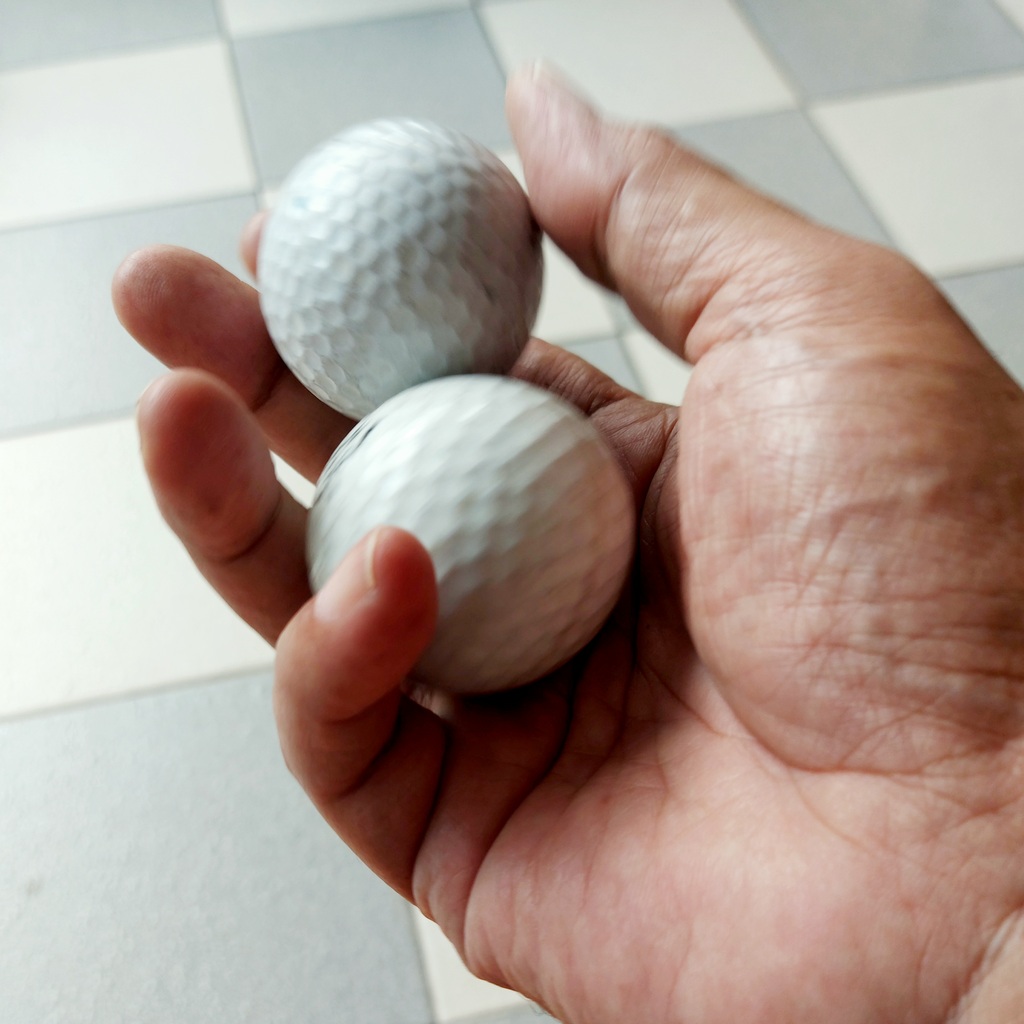 Bola golf untuk mencegah carpal tunnel syndrome akibat Magic Mouse Mac